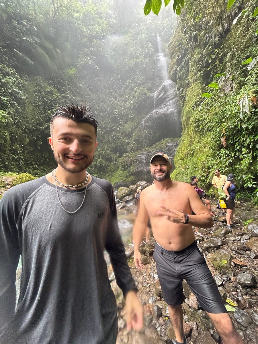 Two friends on a waterfall trail