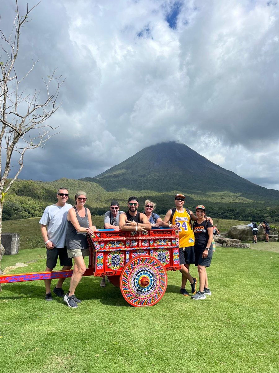 Guests together with a volcano in the background